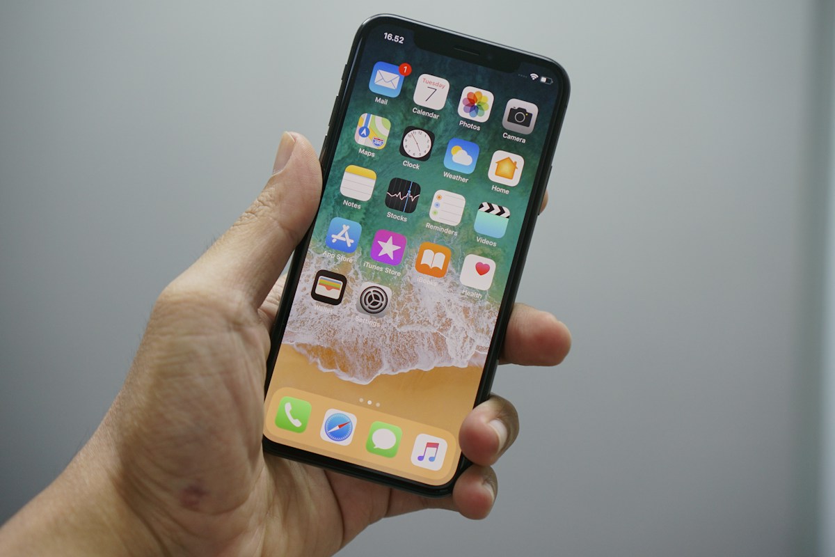 A person holding a phone during everyday use
