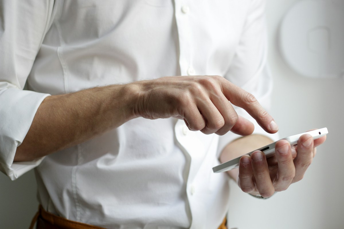 A person using a touchscreen phone