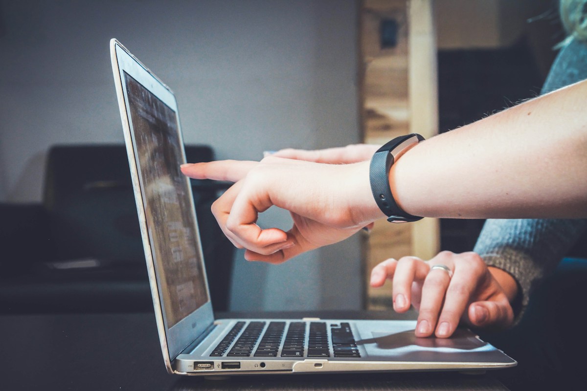 People working together at a laptop